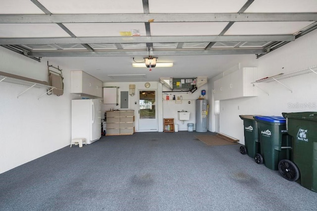 garage featuring electric water heater, white fridge, and electric panel