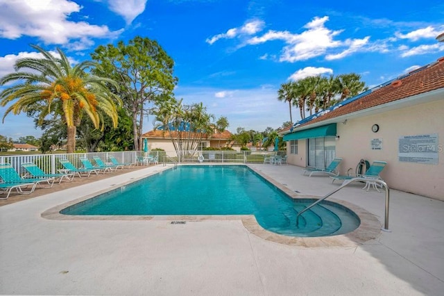 view of swimming pool with a patio