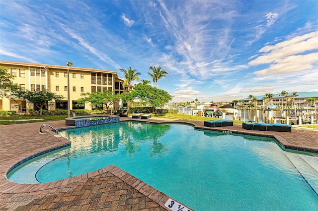 view of pool featuring an in ground hot tub