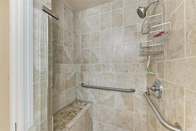 bathroom with tiled shower