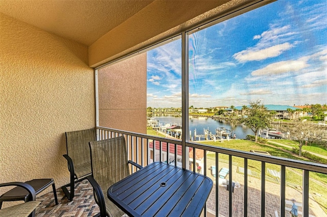 balcony featuring a water view