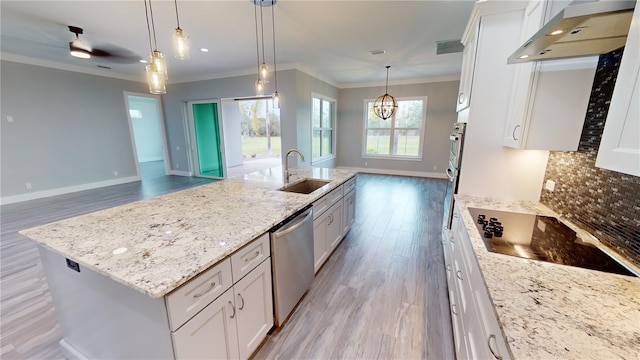 kitchen featuring black electric stovetop, white cabinetry, dishwasher, and a center island with sink