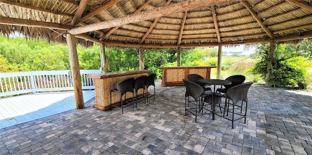 view of patio / terrace featuring a gazebo and a bar