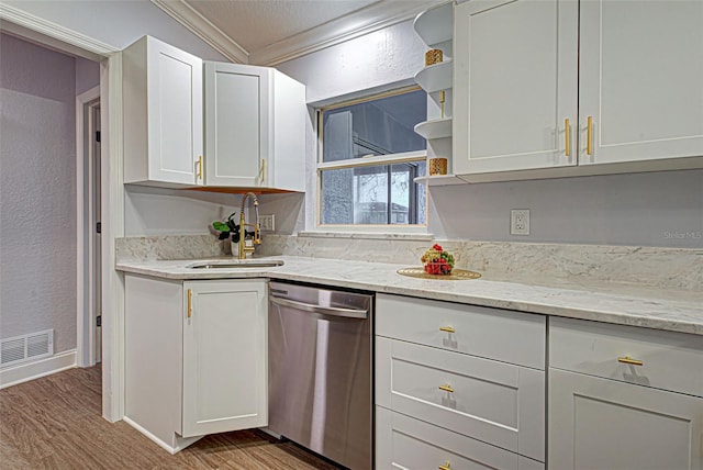 kitchen featuring stainless steel dishwasher, hardwood / wood-style flooring, ornamental molding, white cabinetry, and sink