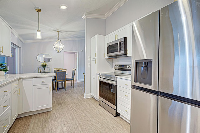 kitchen featuring light stone countertops, hanging light fixtures, appliances with stainless steel finishes, white cabinets, and crown molding