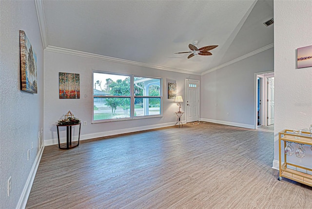 interior space with lofted ceiling, crown molding, ceiling fan, and hardwood / wood-style flooring