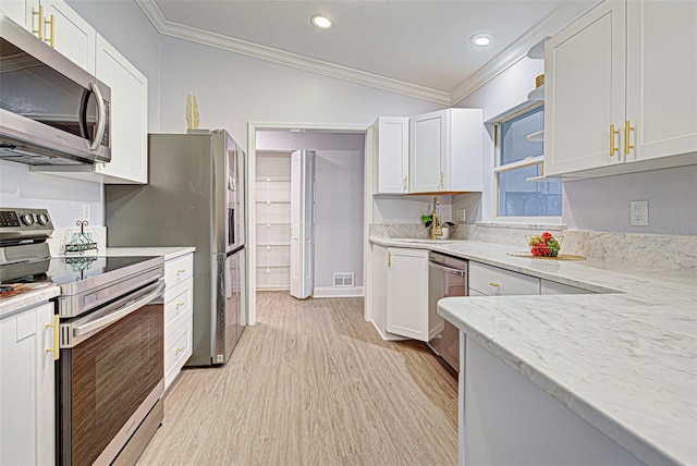 kitchen with white cabinetry, light hardwood / wood-style floors, and appliances with stainless steel finishes