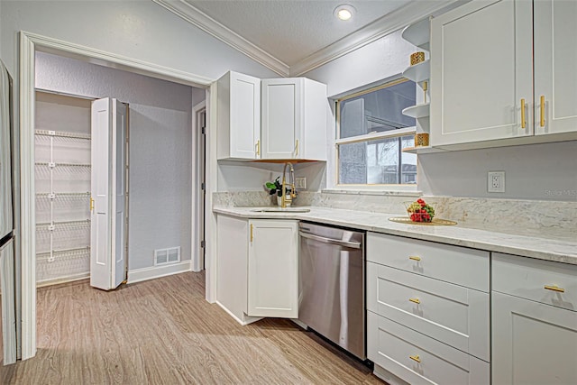 kitchen featuring crown molding, light hardwood / wood-style flooring, white cabinets, and stainless steel dishwasher