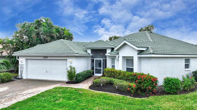 single story home featuring a garage