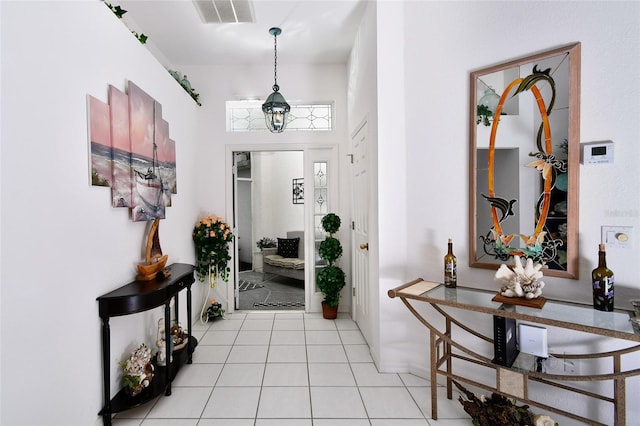 foyer featuring light tile floors