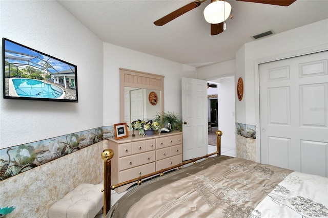 carpeted bedroom featuring a closet and ceiling fan