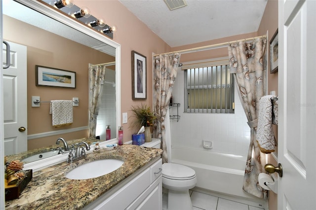 full bathroom with vanity, shower / tub combo with curtain, tile flooring, a textured ceiling, and toilet