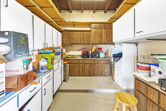 kitchen featuring white cabinets