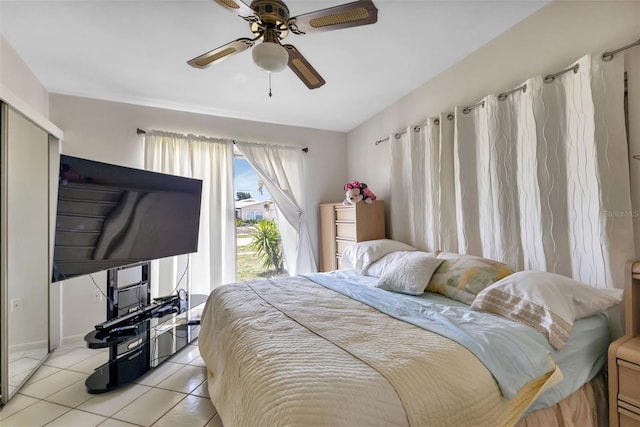 tiled bedroom with ceiling fan