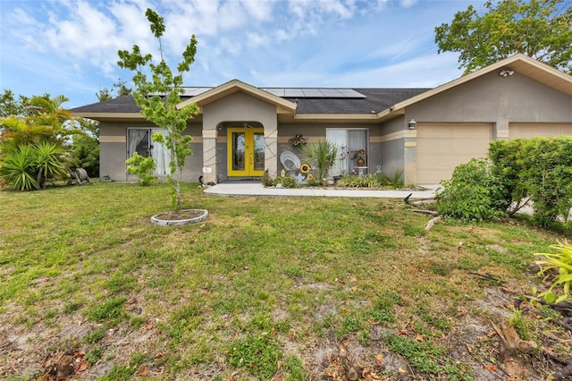 ranch-style house with a front lawn, a garage, and solar panels