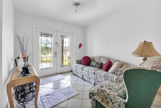 living room with ceiling fan, light tile patterned floors, and french doors