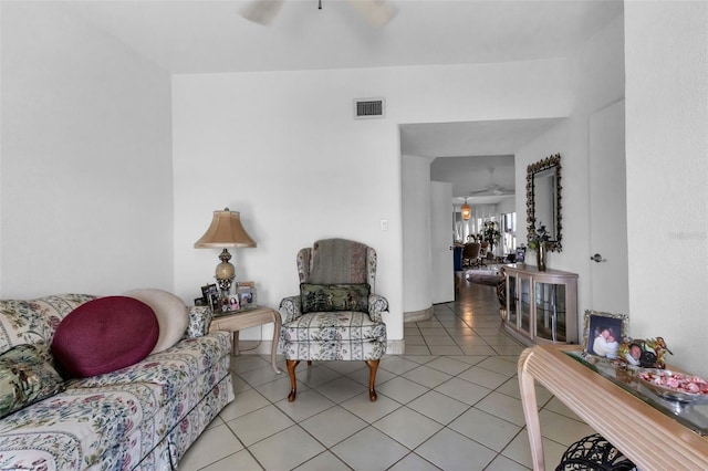 tiled living room featuring ceiling fan