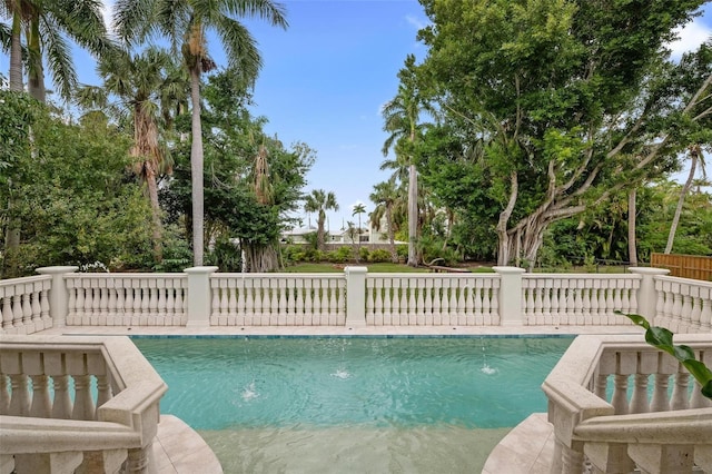 view of swimming pool featuring pool water feature