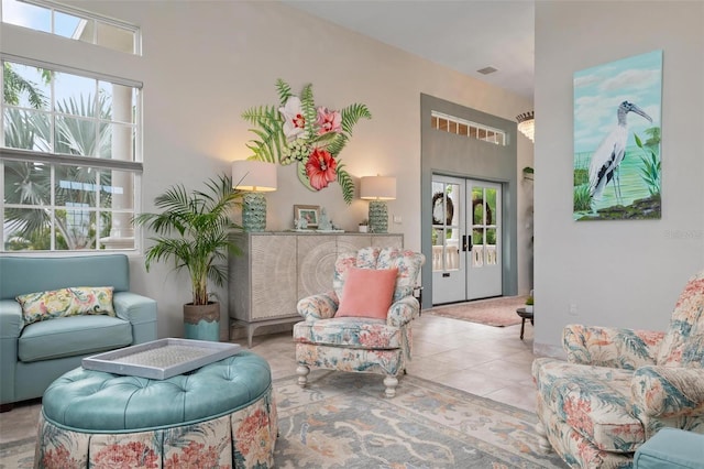 interior space featuring light tile patterned floors and french doors