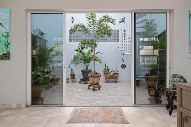 entryway with light tile patterned floors