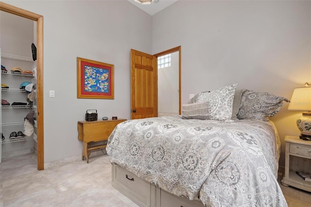 bedroom featuring a closet and a walk in closet