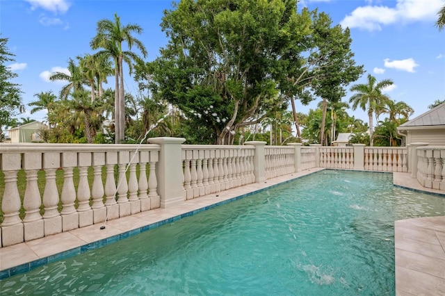 view of swimming pool featuring pool water feature