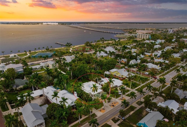 aerial view at dusk with a water view