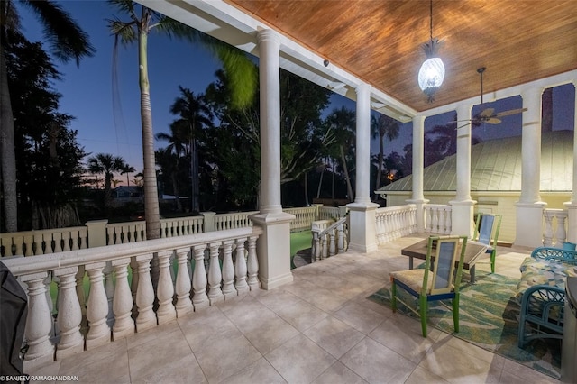 view of patio terrace at dusk