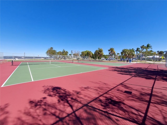 view of tennis court featuring basketball court