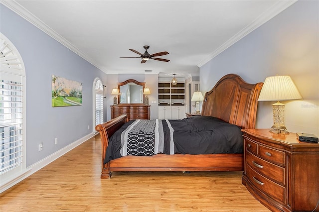 bedroom featuring crown molding, ceiling fan, and light hardwood / wood-style flooring