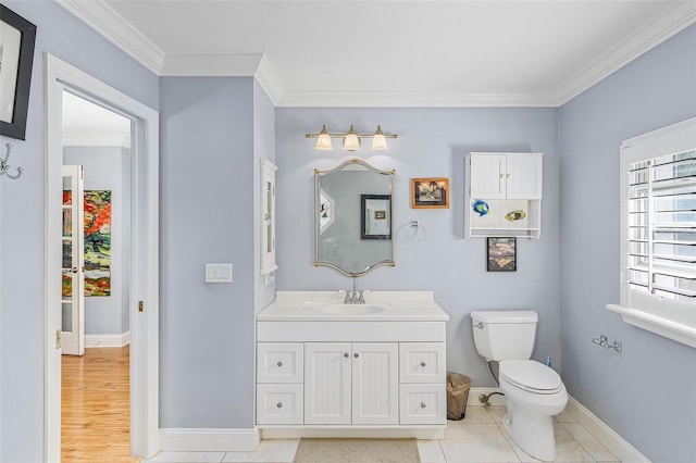 bathroom featuring wood-type flooring, toilet, ornamental molding, and vanity