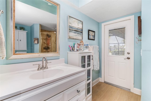 bathroom featuring hardwood / wood-style floors and vanity