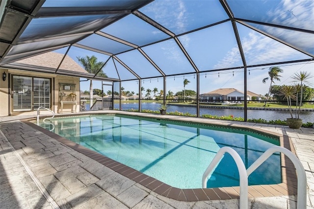 view of swimming pool featuring a lanai and a patio