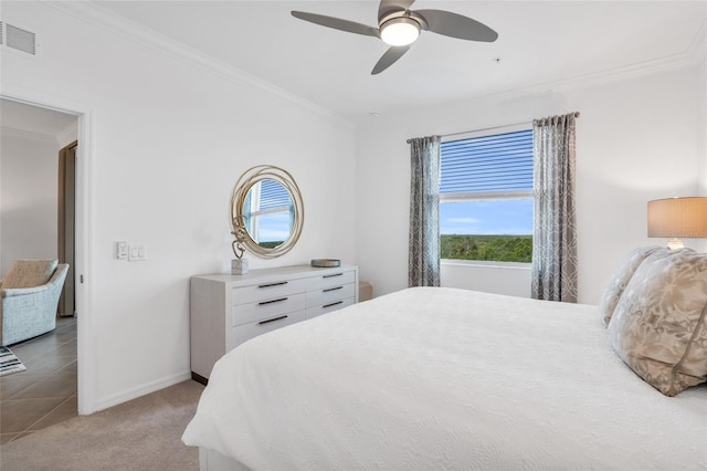 tiled bedroom featuring ceiling fan and ornamental molding