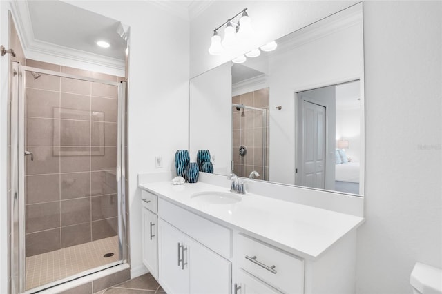 bathroom featuring toilet, crown molding, an enclosed shower, tile flooring, and large vanity