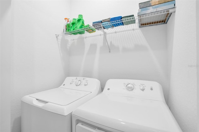 washroom with independent washer and dryer