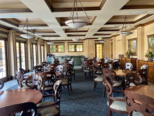 dining space featuring ornamental molding, a wealth of natural light, coffered ceiling, and beamed ceiling