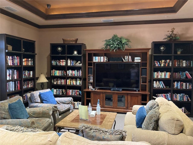 living room featuring a tray ceiling