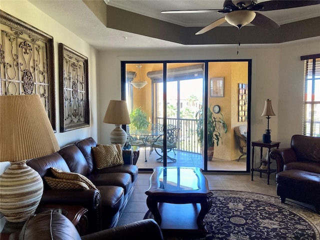 98 Vivante Blvd Unit 98412, Punta Gorda, FL 33950 - living area featuring plenty of natural light, ornamental molding, a ceiling fan, and tile patterned flooring