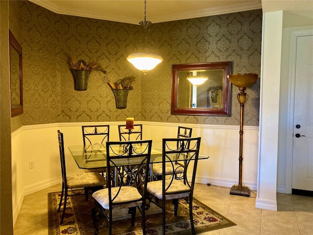 tiled dining space featuring crown molding