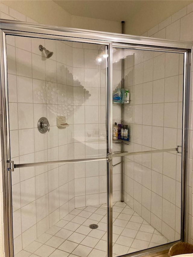 bathroom with a shower with shower door