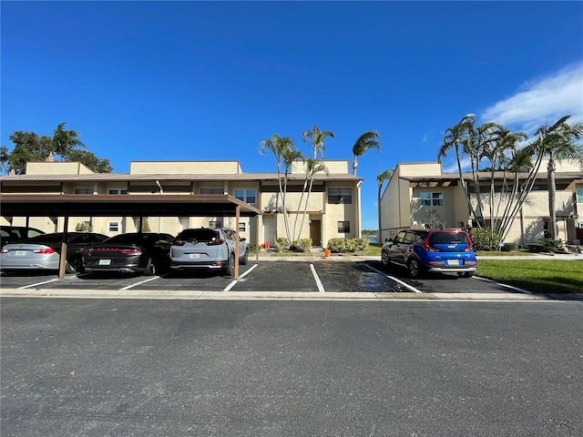 view of partially covered parking lot