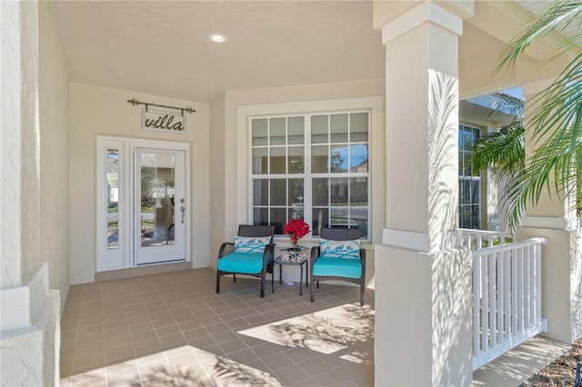 doorway to property featuring covered porch