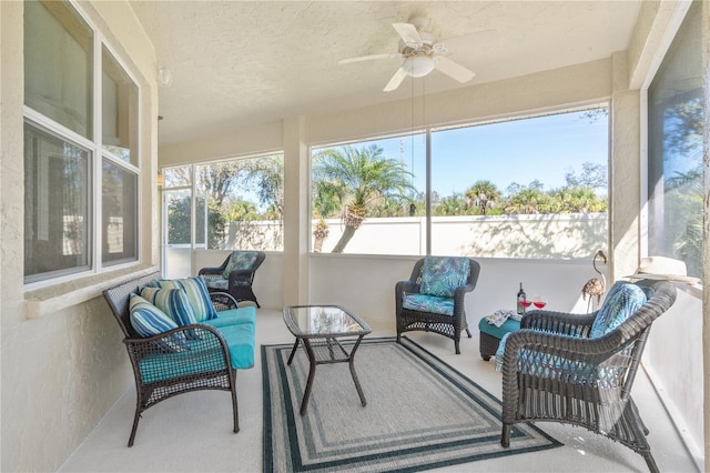 sunroom featuring ceiling fan