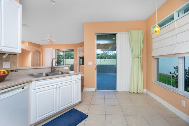 kitchen with hanging light fixtures, sink, white cabinets, and white dishwasher