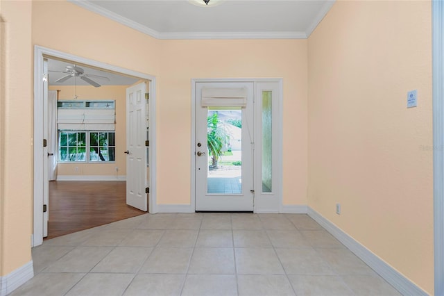 entrance foyer with ornamental molding and light tile patterned flooring