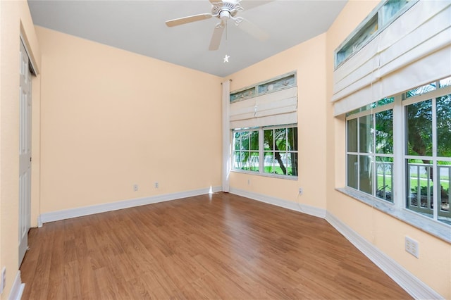 unfurnished room featuring hardwood / wood-style flooring and ceiling fan