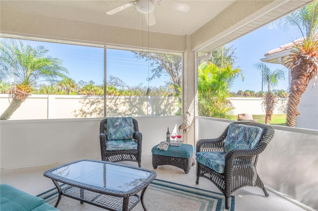 sunroom / solarium featuring ceiling fan