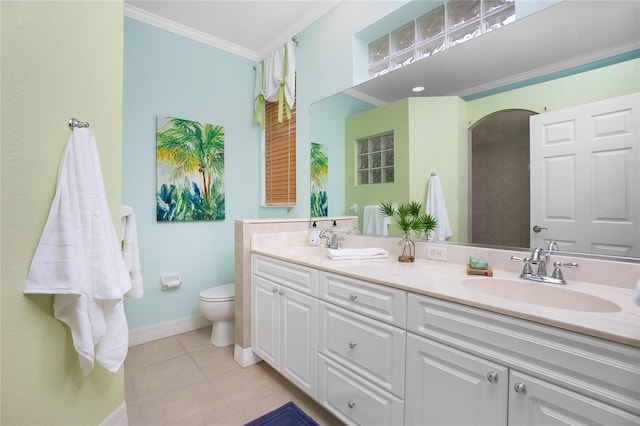 bathroom featuring vanity, tile patterned floors, ornamental molding, and toilet