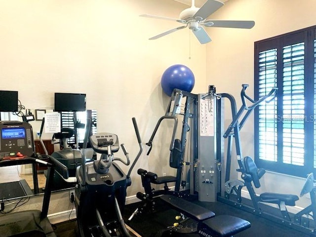 exercise room with ceiling fan